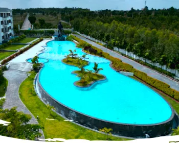Infinity pool with palm islands at Sportico Resorts