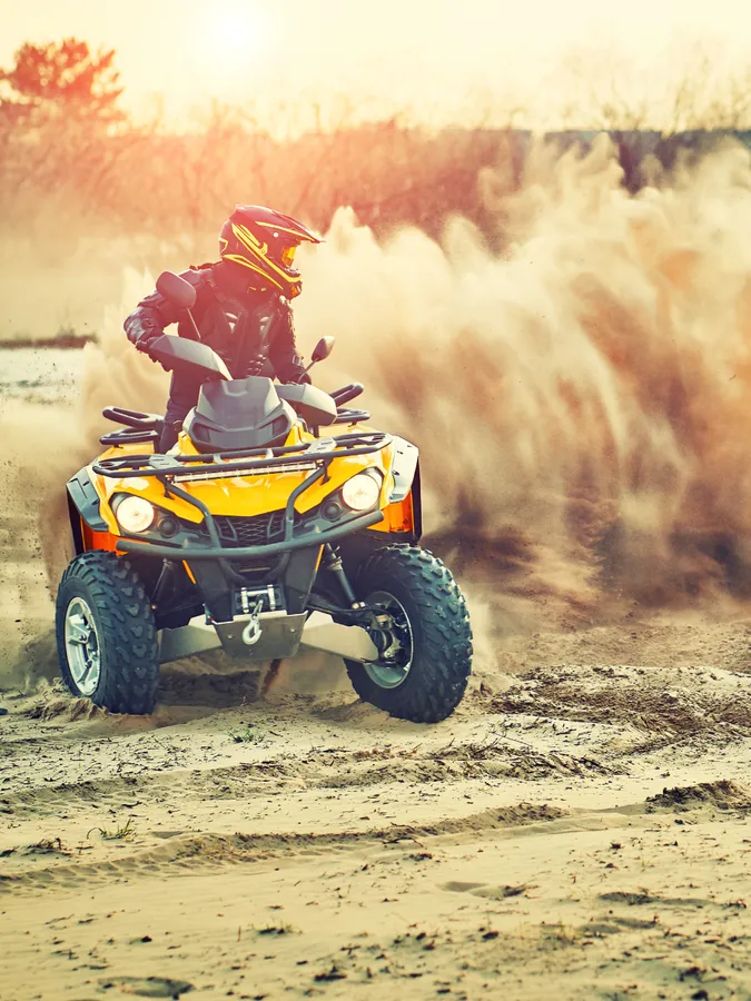 Yellow dirt kart buggy sliding on the track