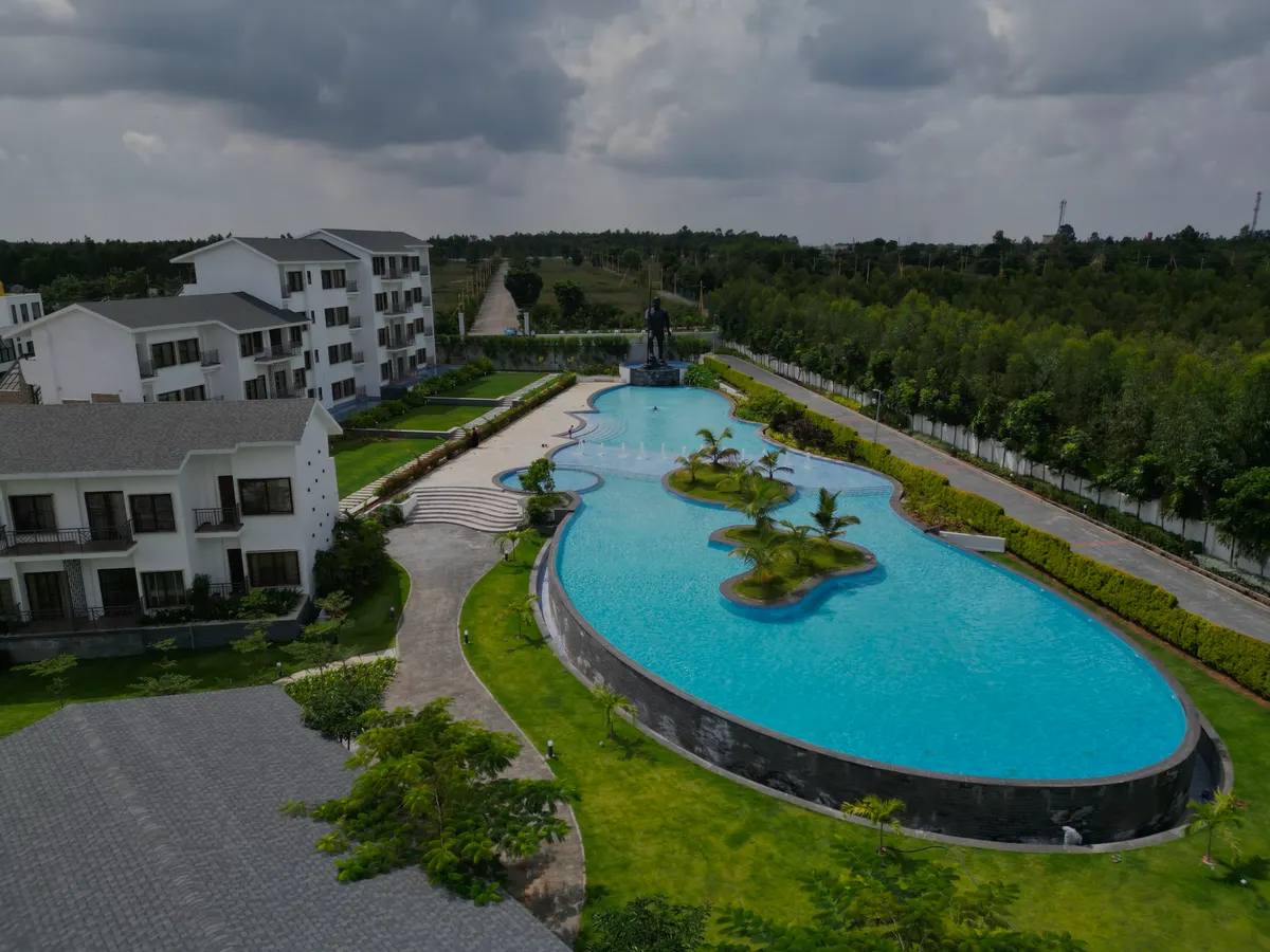 Aerial view of the island pool at Sportico Resorts