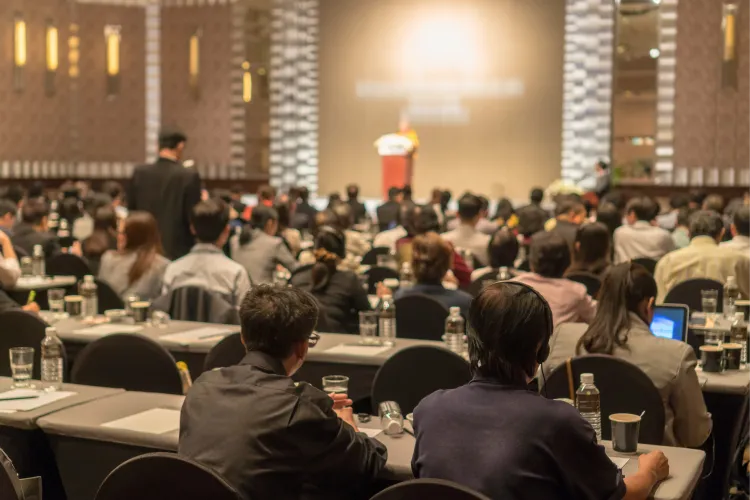 Guests seated at a launch event in the banquet hall