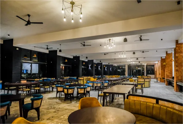 Saffron restaurant dining hall with yellow chairs