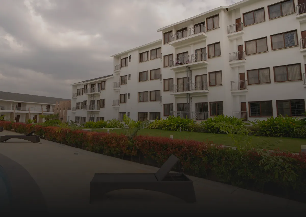 Sportico Resorts room block at dusk