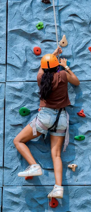 Guest climbing the wall climbing tower