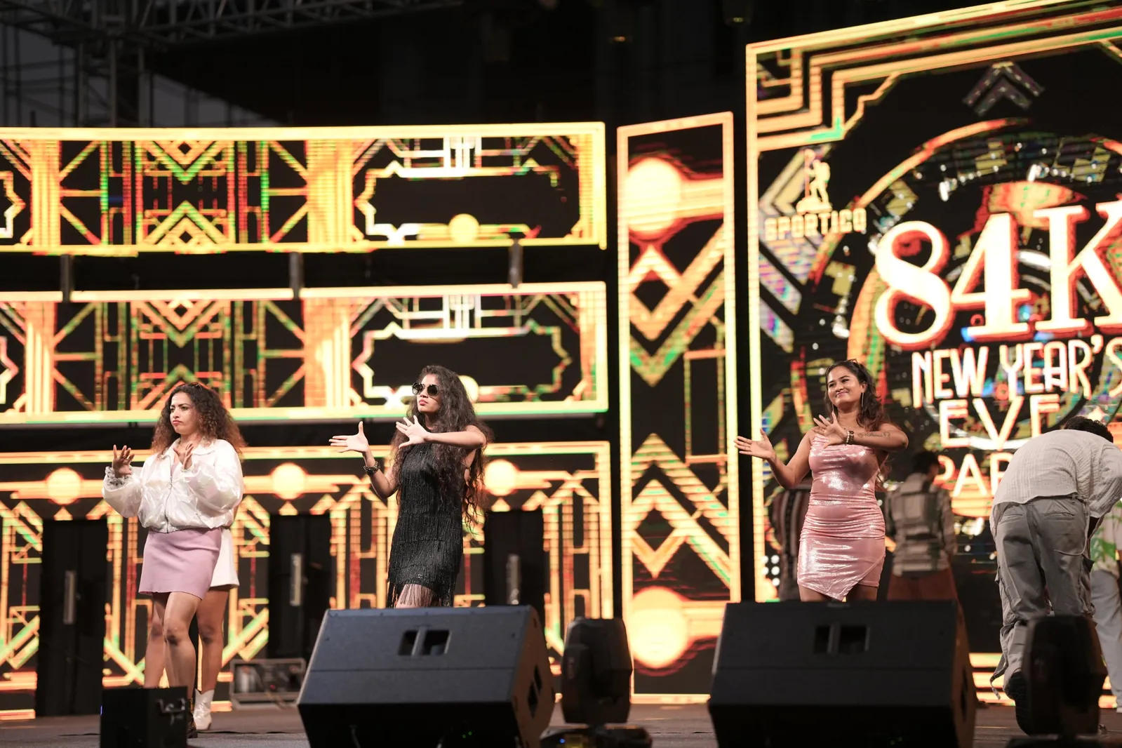 Dancers performing on the New Year party stage at Sportico Resorts