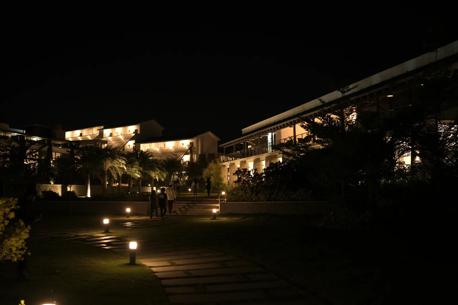 Sportico Resorts rooms lit up at night in Malur for a New Year stay near Bangalore