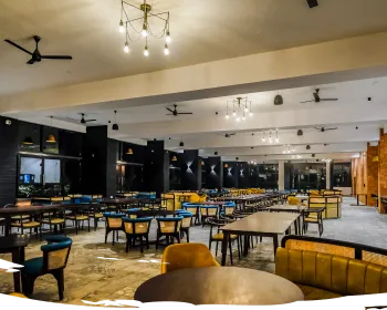 Saffron Restaurant dining hall at Sportico Resorts near Bangalore