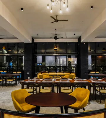 Restaurant dining area at Sportico Resorts near Bangalore