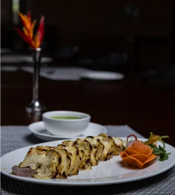Plated dish and soup at the restaurant, Sportico Resorts near Bangalore