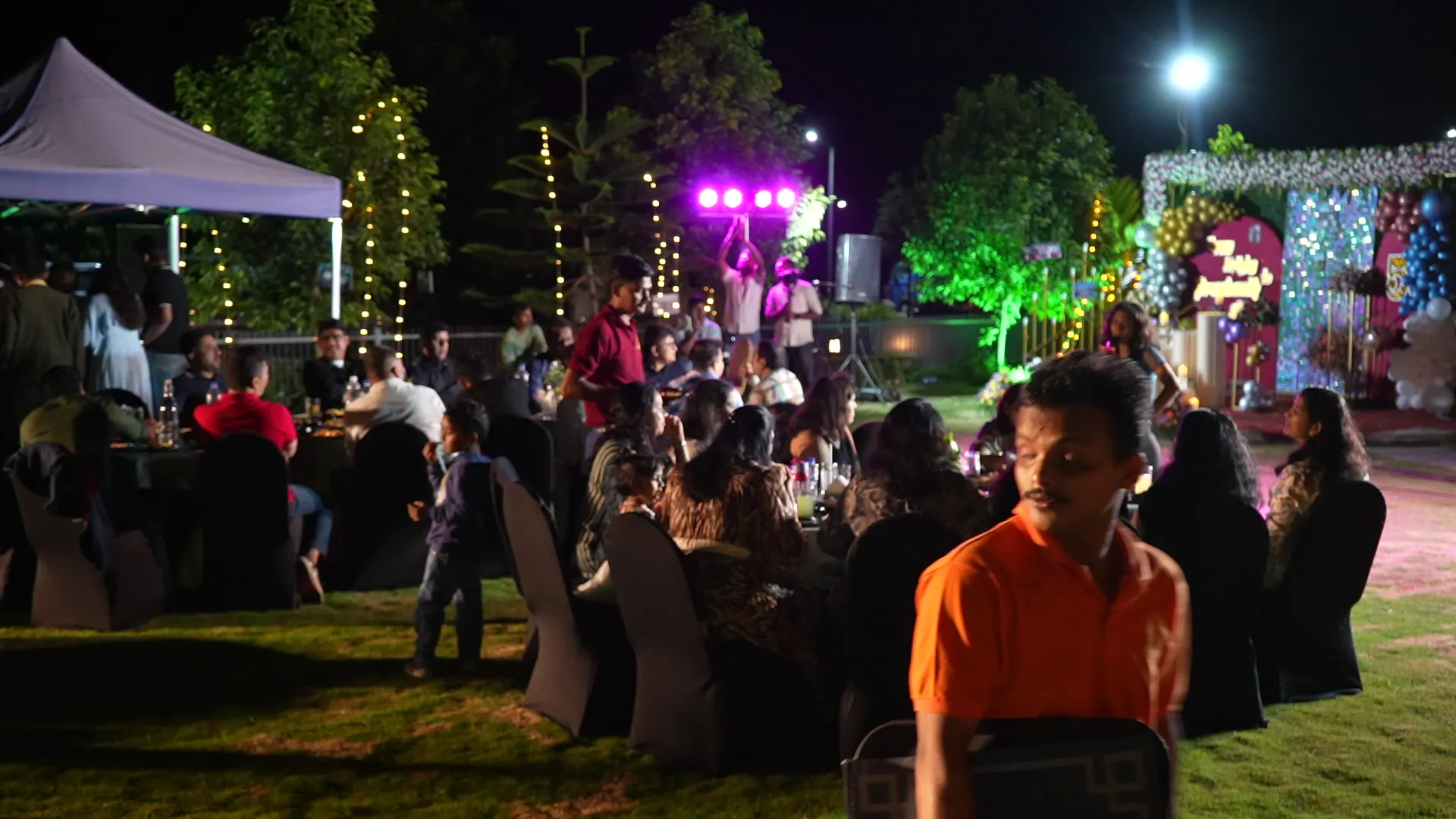 Dinner on the lawn under lights at Sportico Resorts