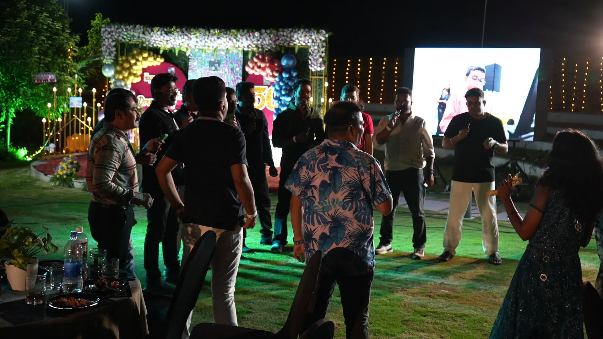 Night party on the lawn with LED screen and lights