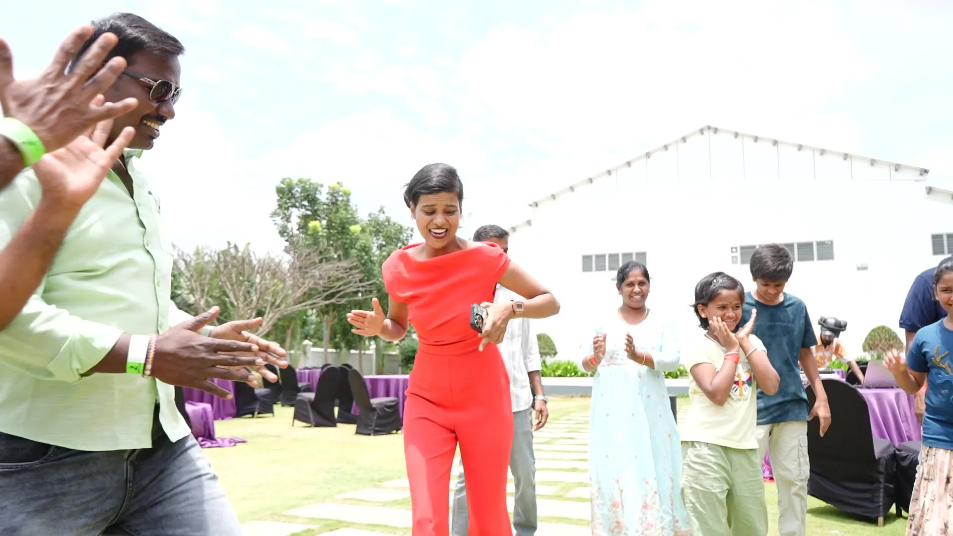 Team dancing on the lawn at a corporate outing