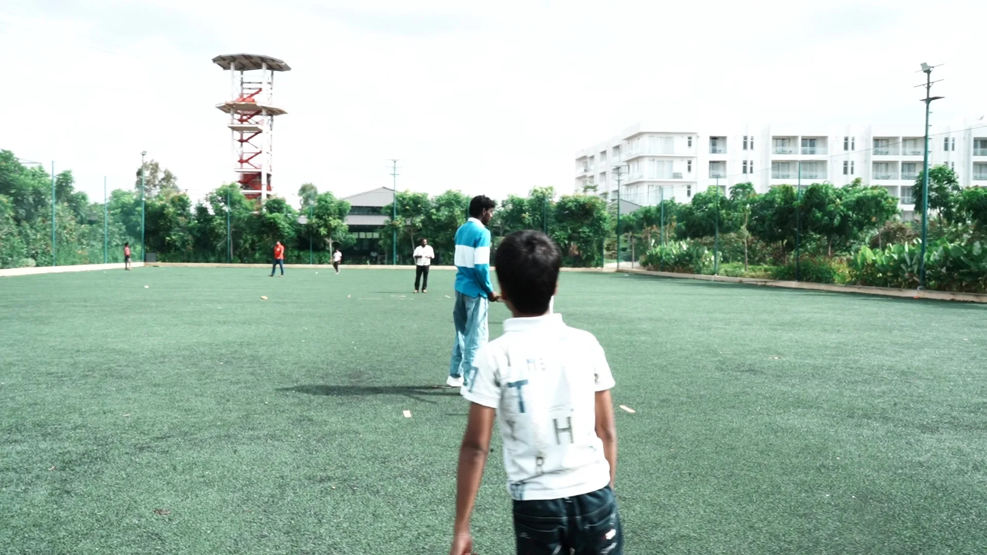 Cricket on the turf ground at Sportico Resorts