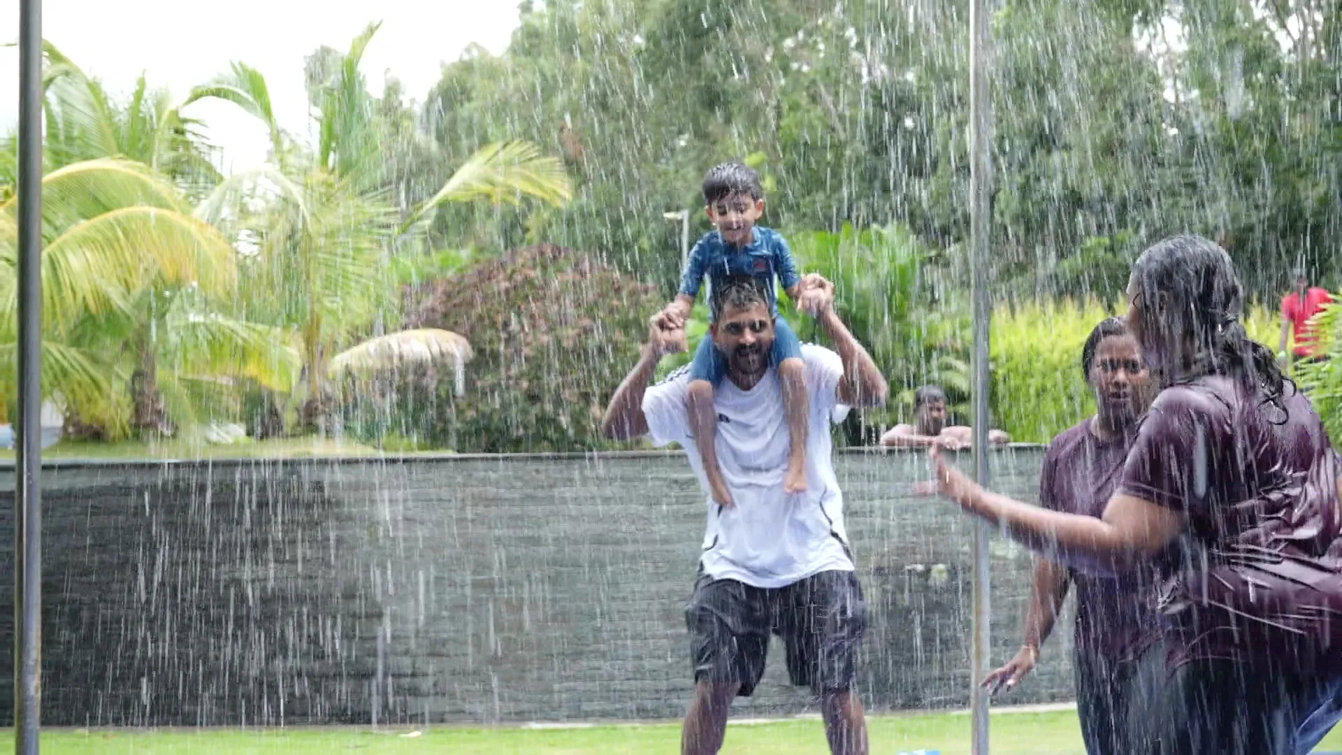 Family with a child at the rain dance, Sportico Resorts