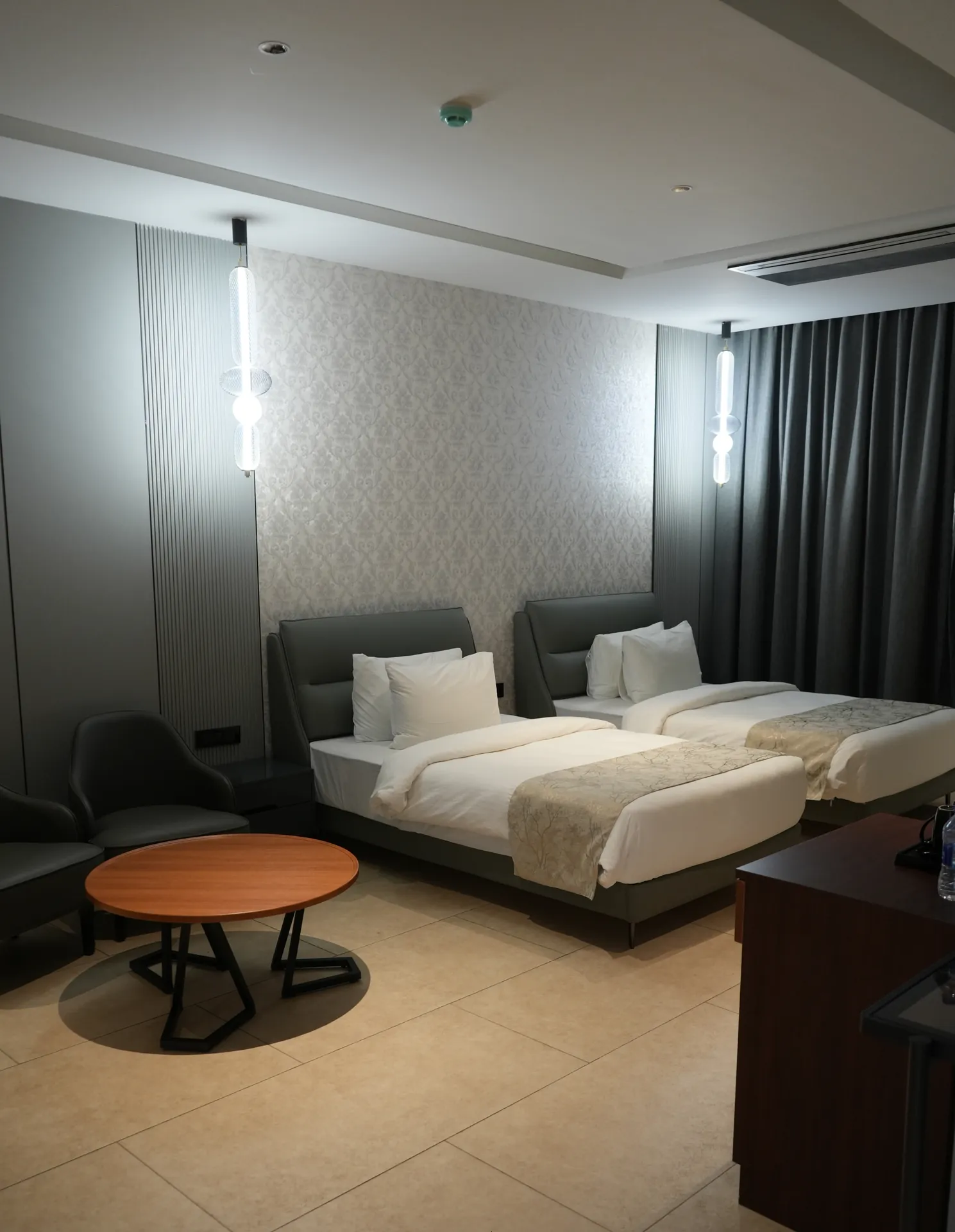 Twin-bed guest room at Sportico Resorts