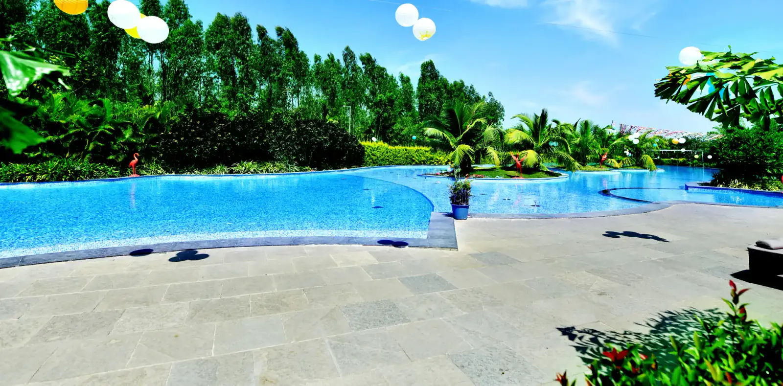 Infinity pool decorated with lanterns for a poolside event