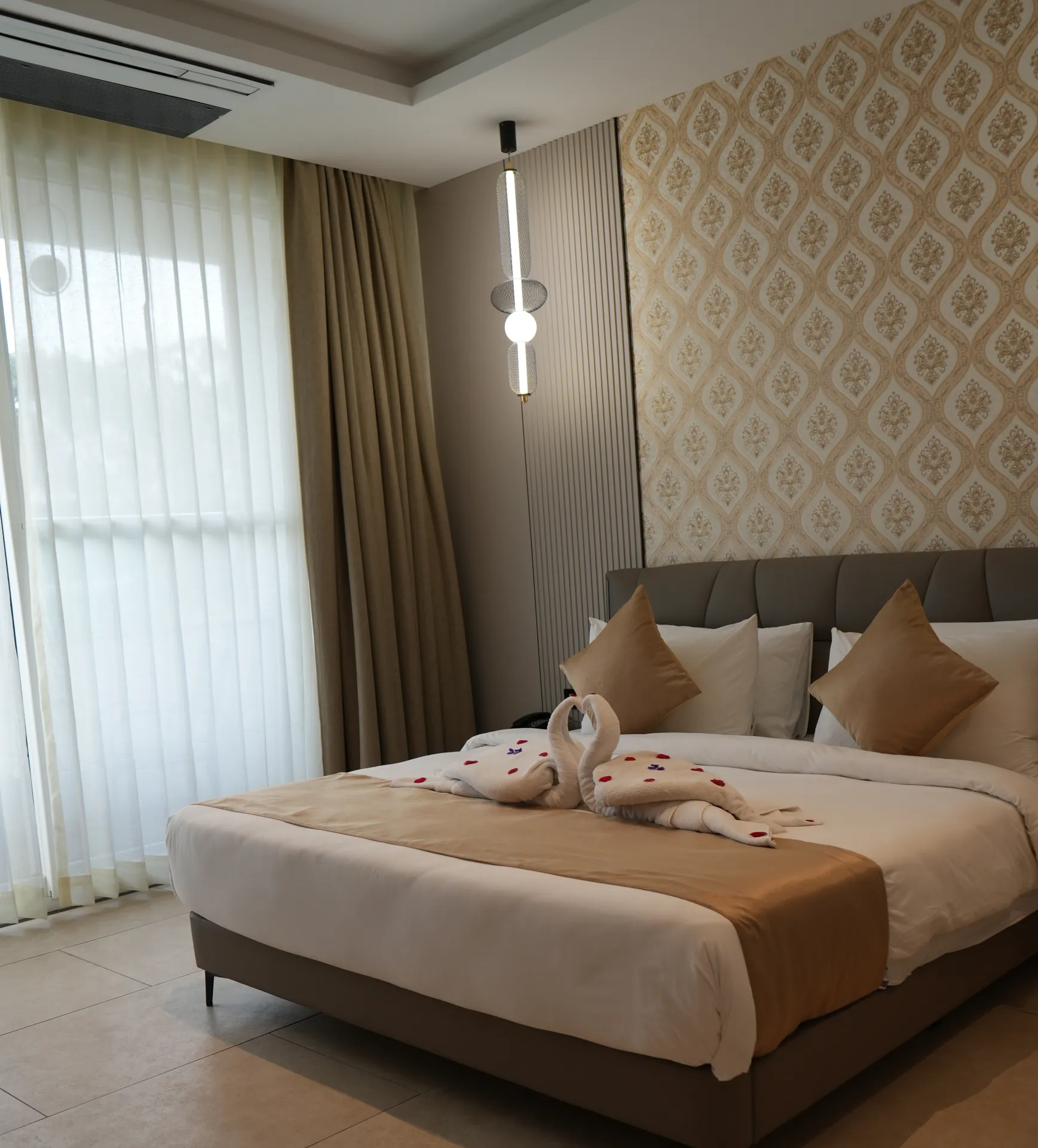 Suite bedroom for a night stay at Sportico Resorts