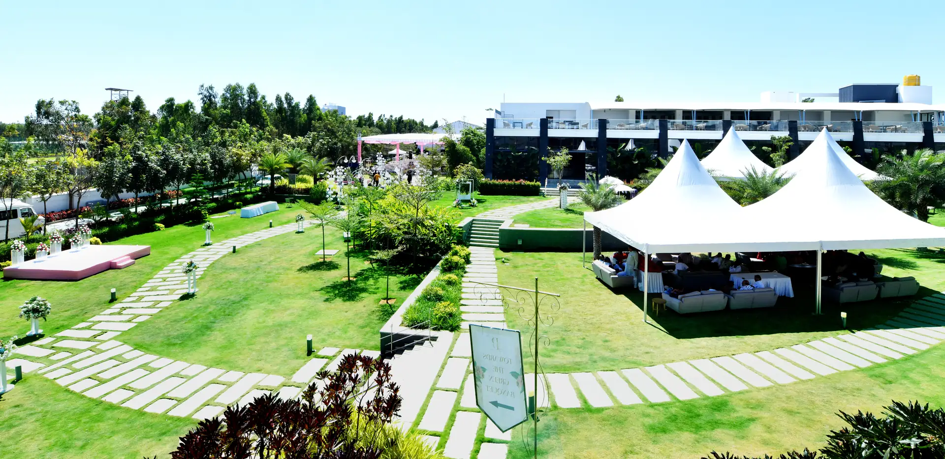 Aerial view of the wedding lawns and tents at Sportico Resorts