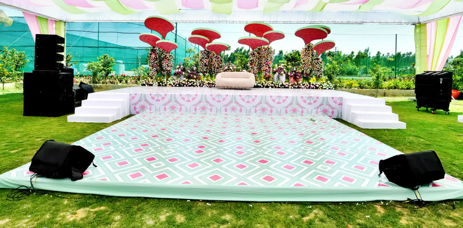 Sangeet stage and dance floor at Sportico Resorts